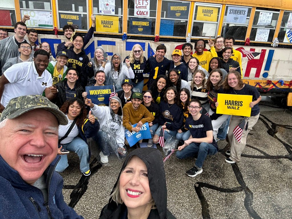 ‘Pissed off’ Michigan fans boo Walz after his motorcade forces them to wait in the rain for Minnesota game