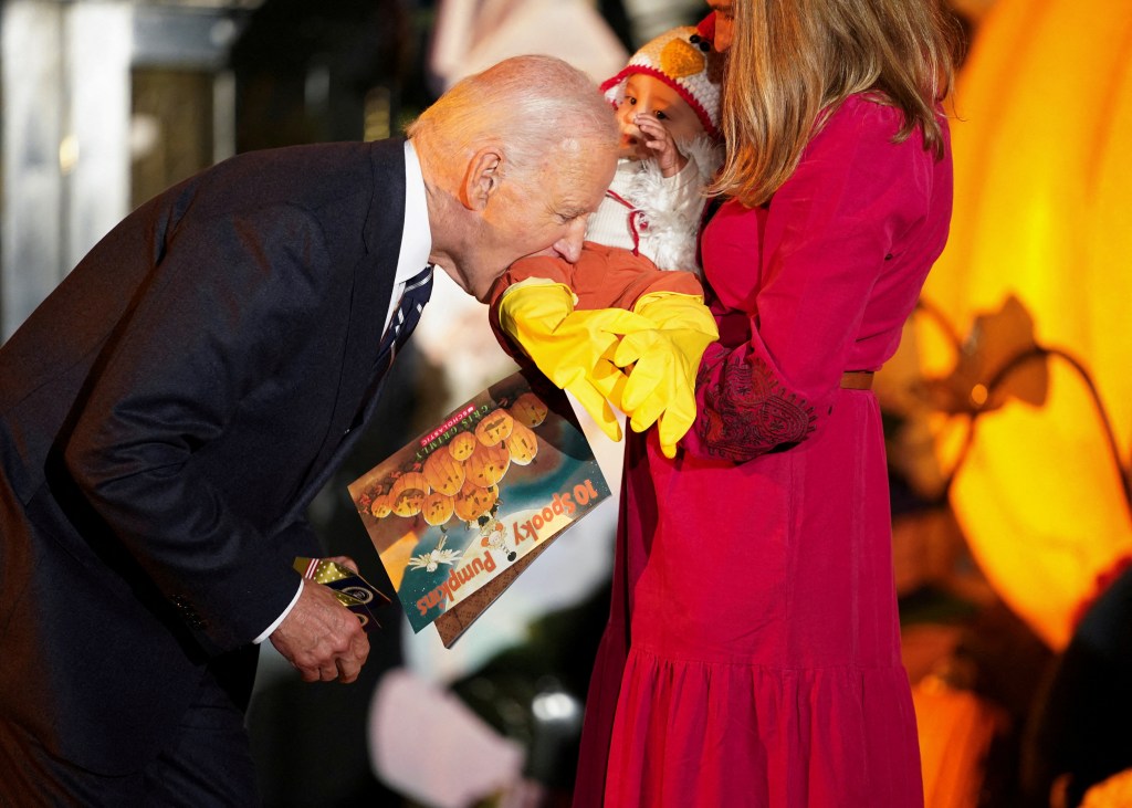 Biden, 81, bites baby dressed as chicken during WH Halloween event