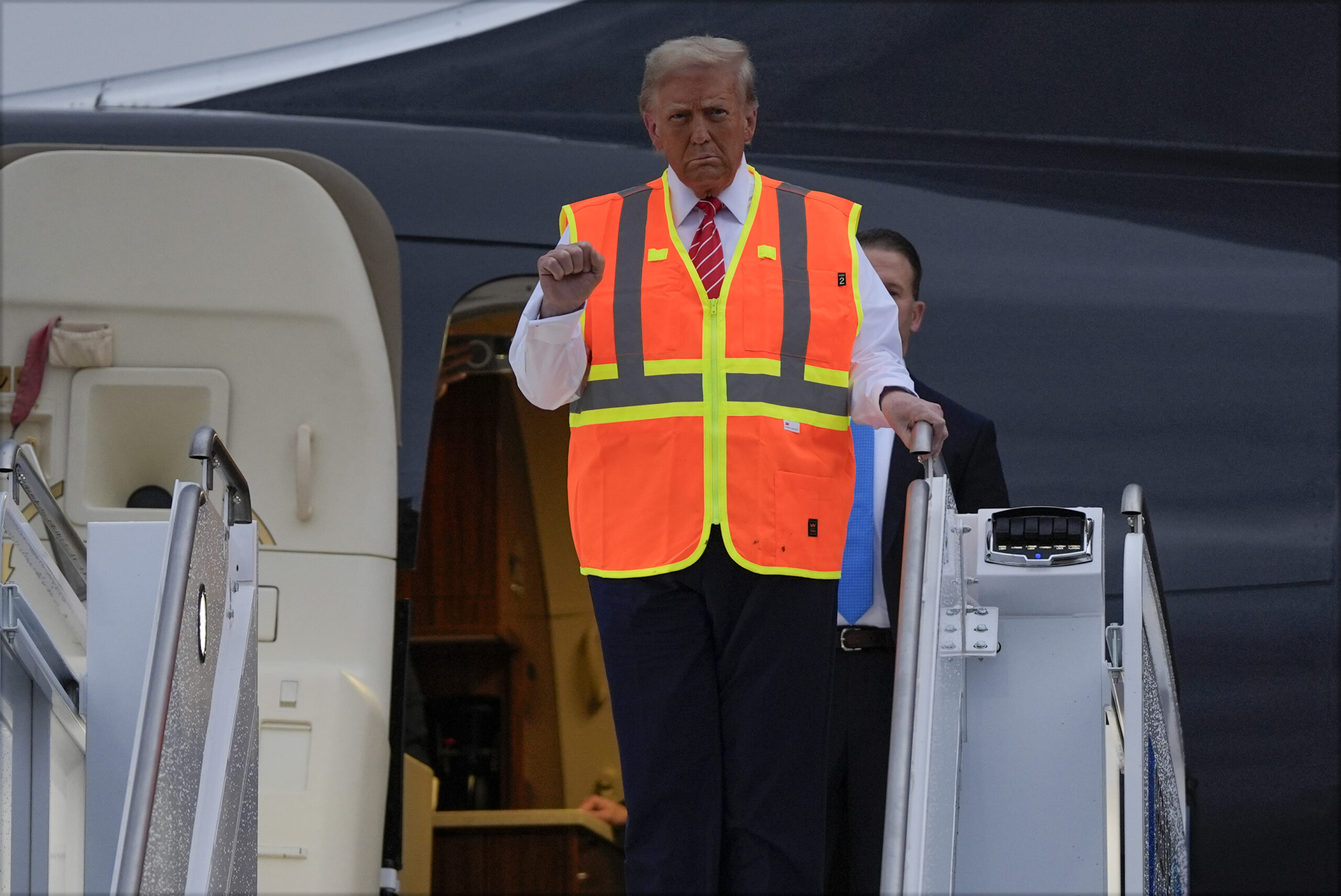 Trump rides in ‘big, beautiful’ MAGA garbage truck after Biden attack on his supporters