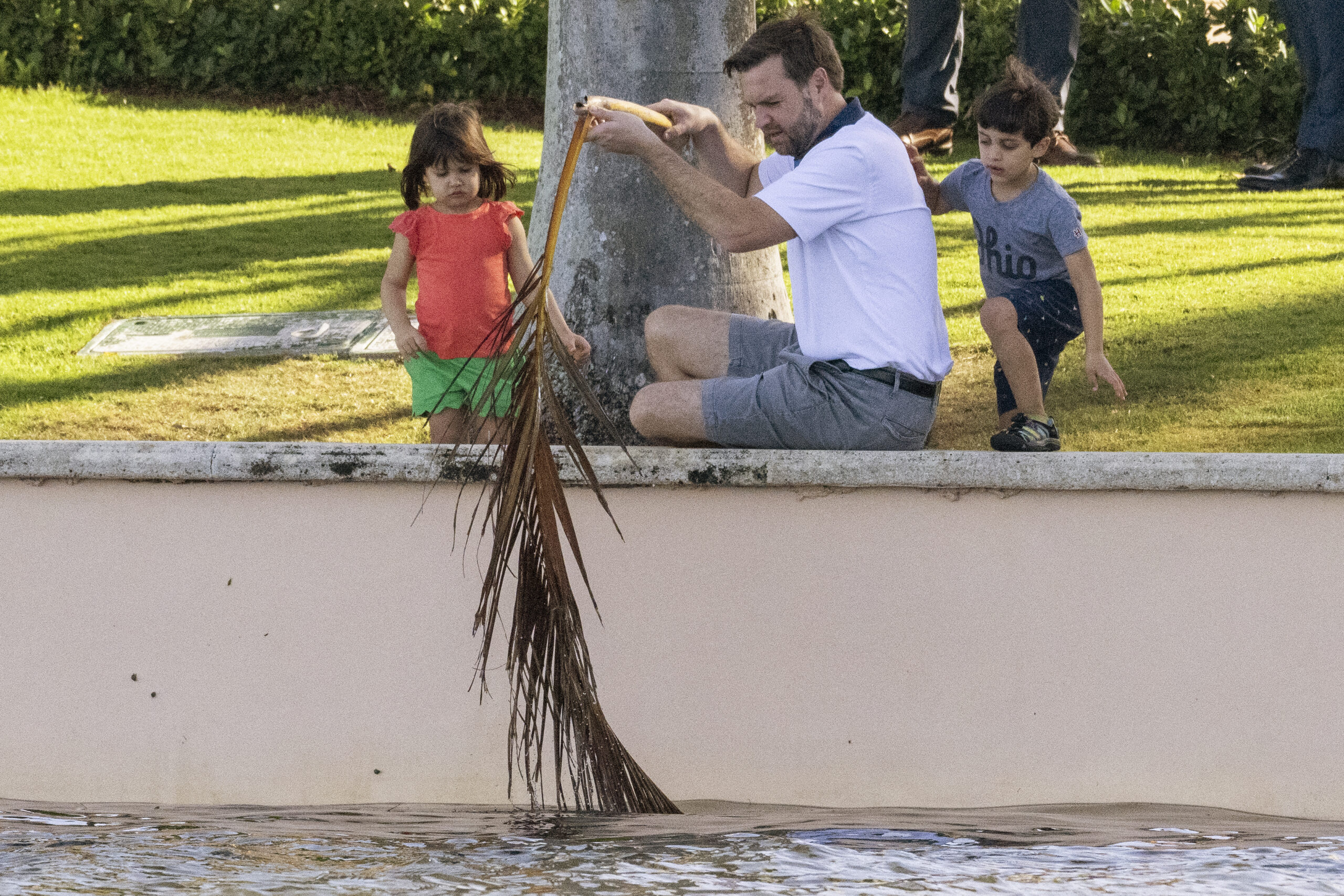 JD Vance plays with his three young kids as robot dog Spot stands guard at Mar-a-Lago