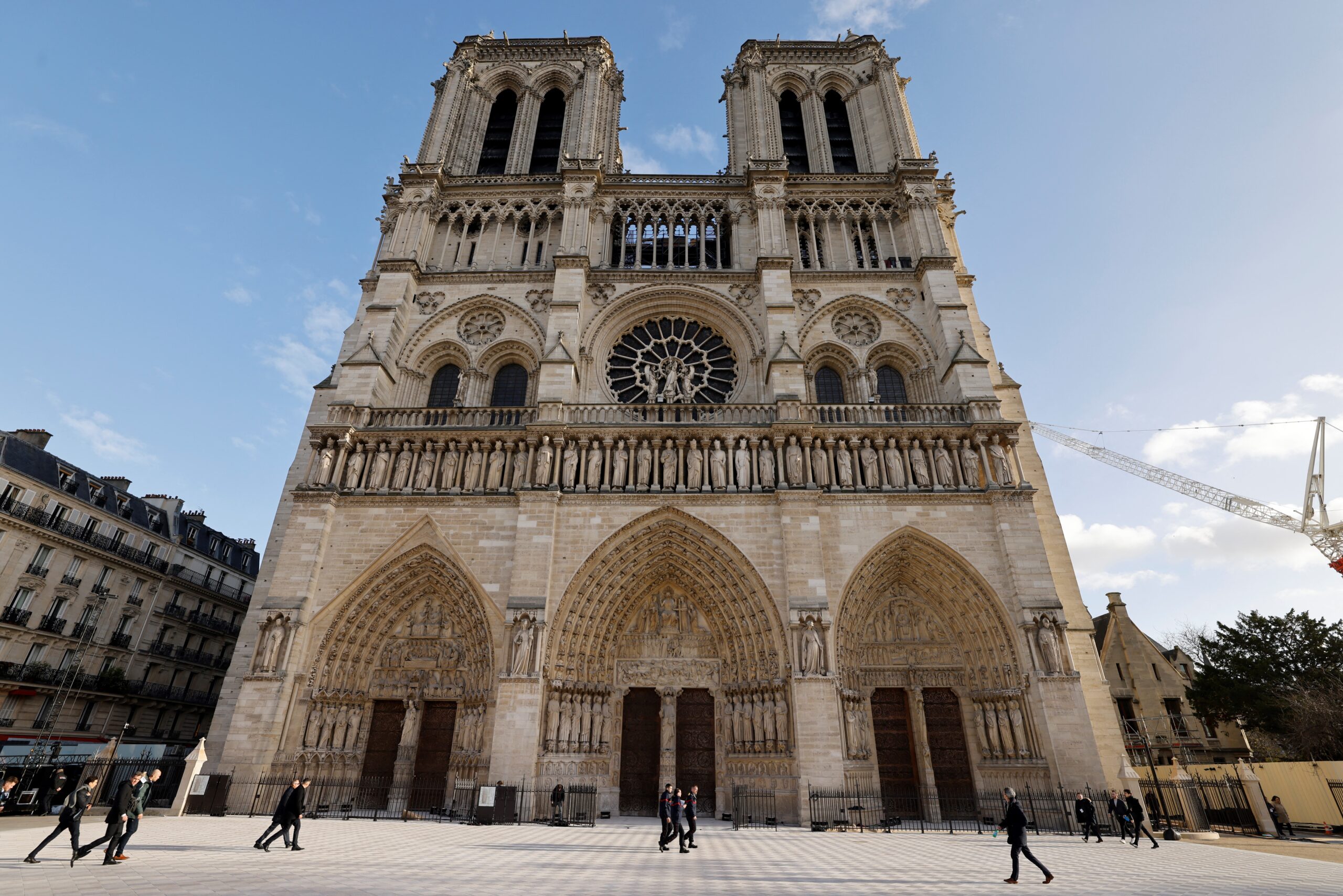 Trump dominates Macron during tense handshake as leaders meet ahead of Notre Dame reopening