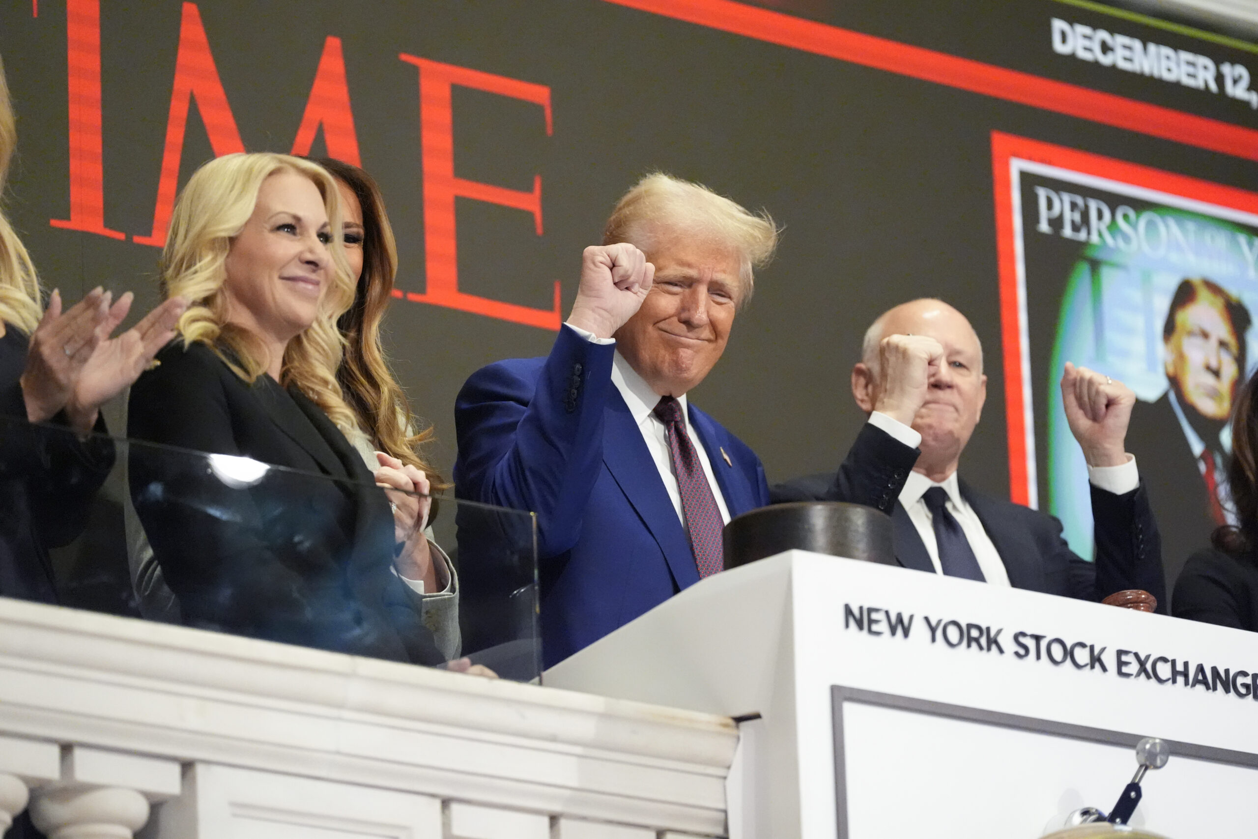 Trump rings opening bell at NYSE in front of Time ‘Person of the Year’ cover with Melania and daughters by his side
