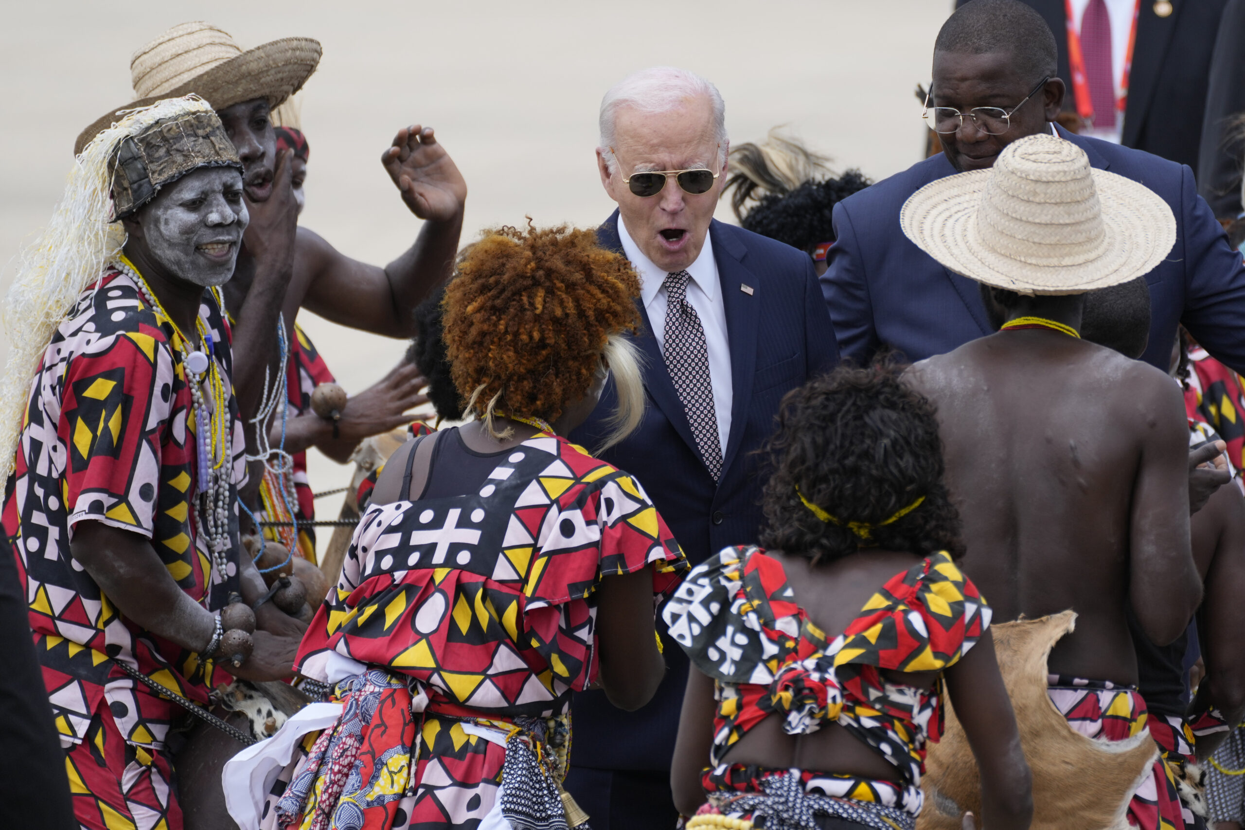 Biden looks shocked by Angolan dance group — then sleepy at railway summit