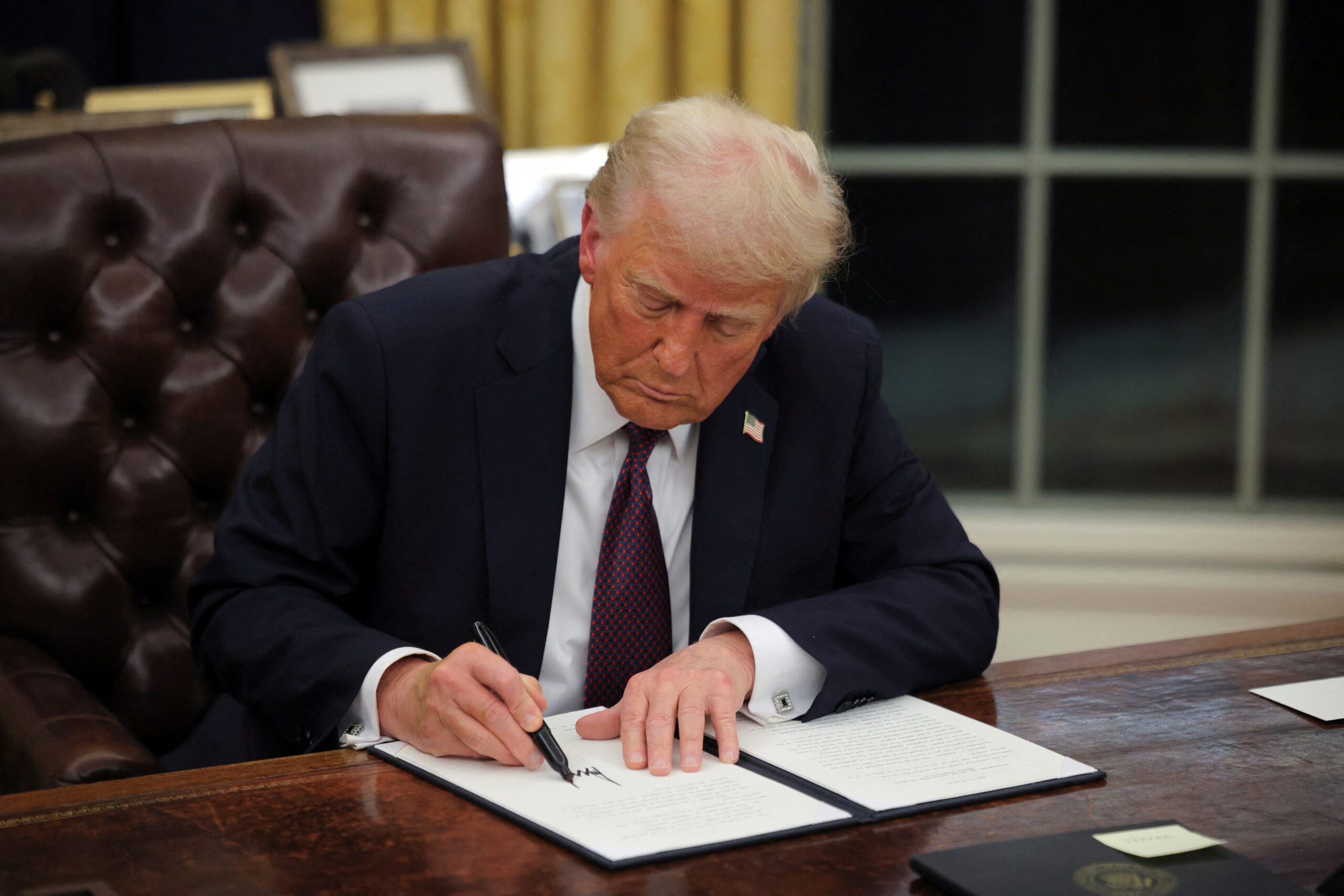 Trump signs dozens of executive orders in flurry of Day 1 activity moments after swearing-in