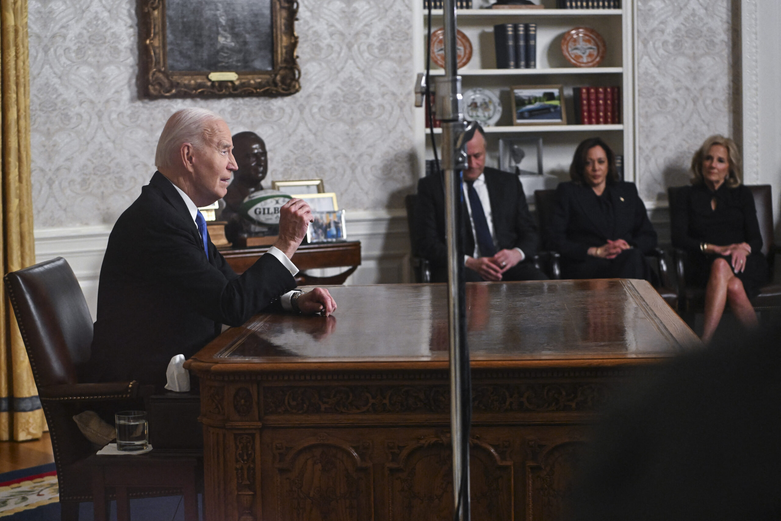 Biden sits on pillow to boost himself up during farewell Oval Office address