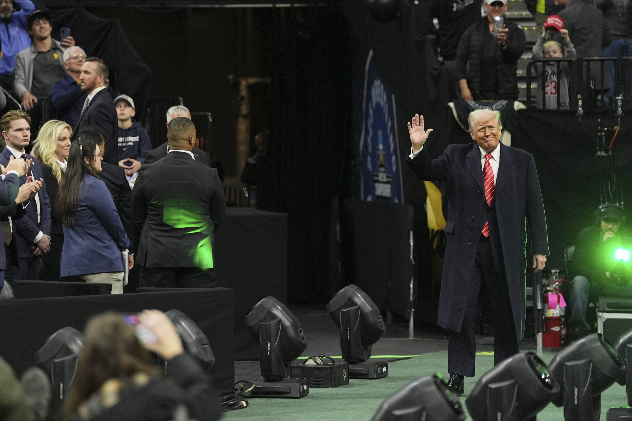 Trump greeted with huge cheers from ecstatic crowd as he attends NCAA wrestling championships