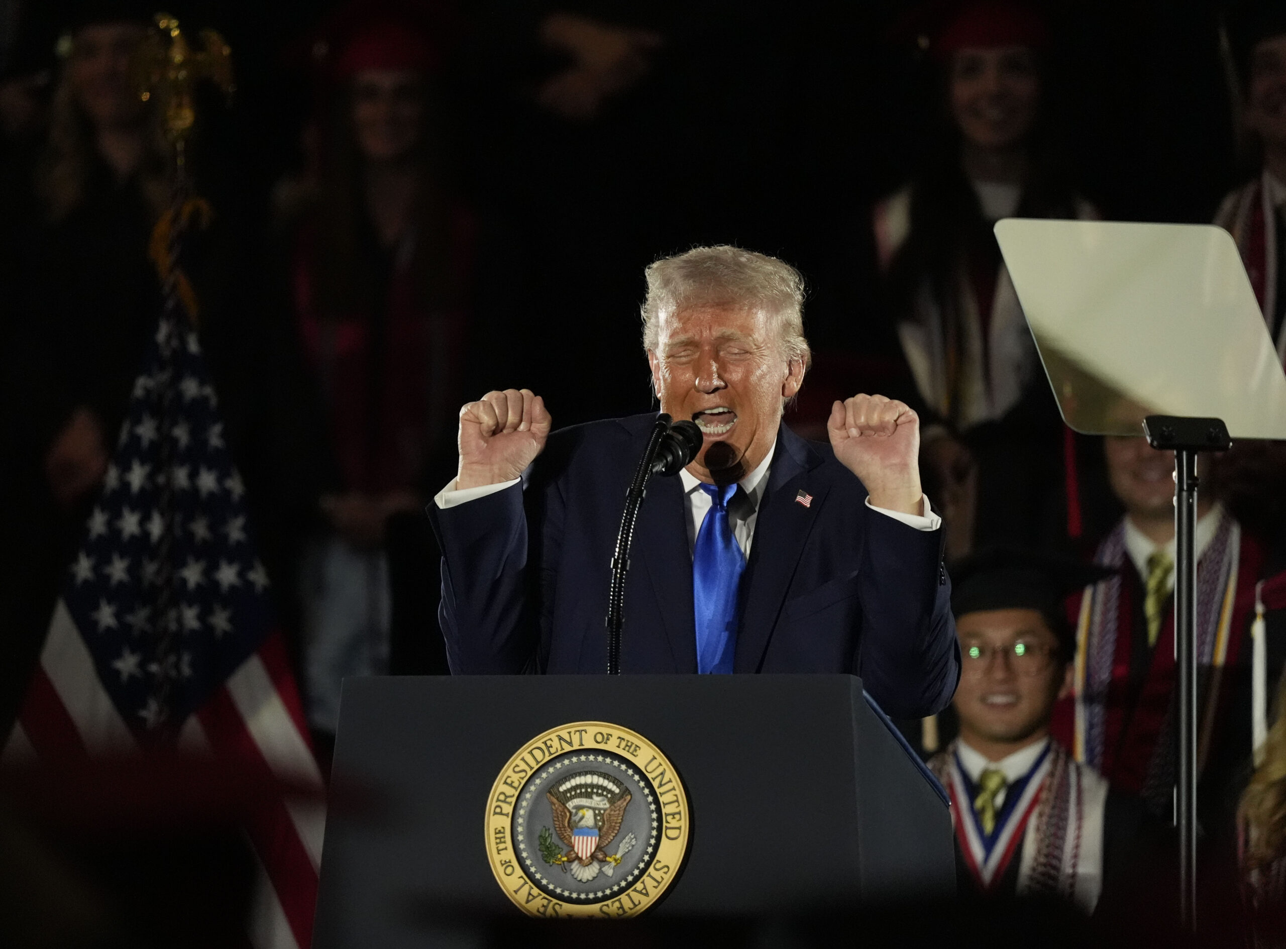 Trump quips he’s ‘in trouble’ with Melania as he impersonates trans athlete at University of Alabama commencement speech