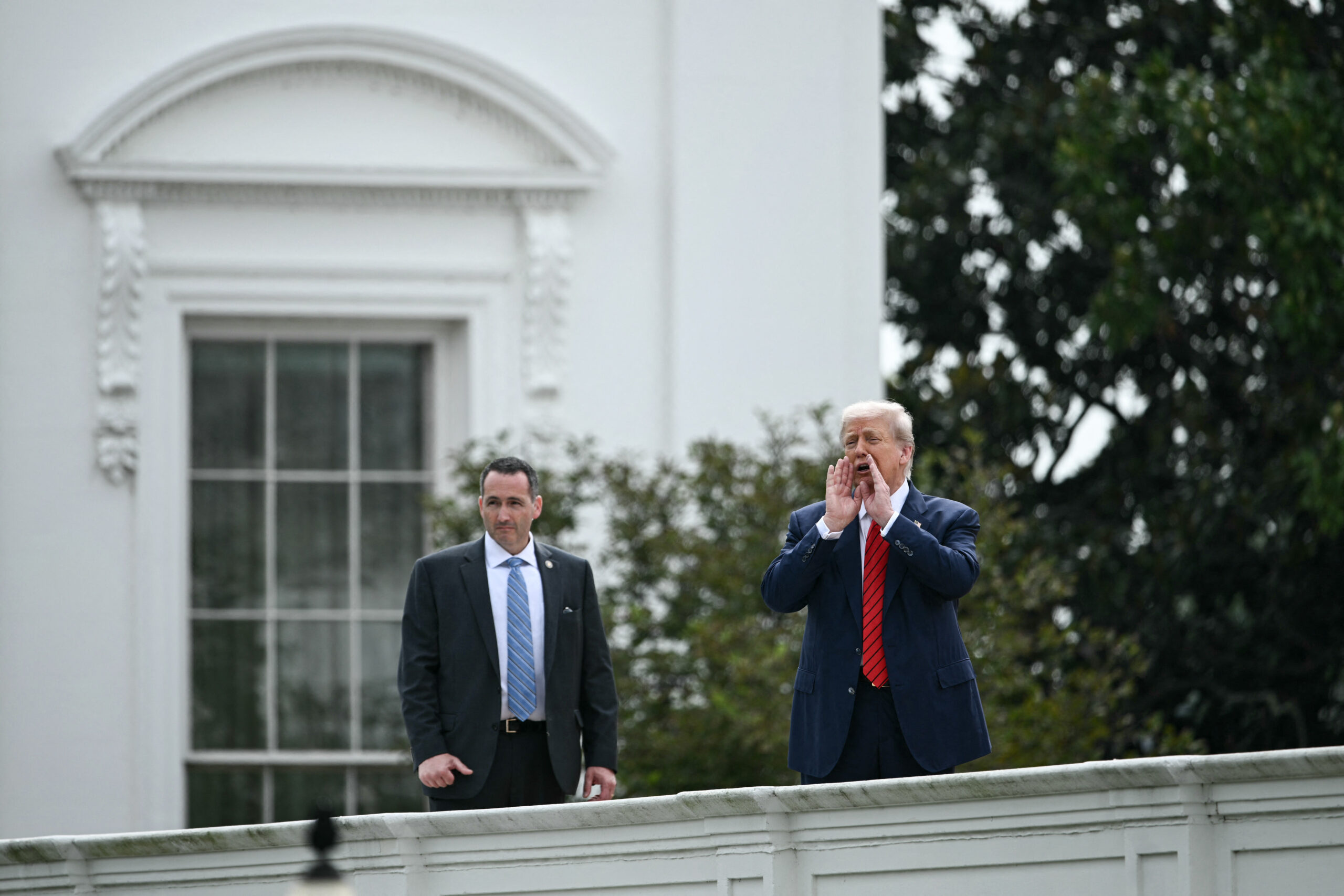 Trump walks along White House roof, jokes he’s ready to install ‘nuclear missiles’ there