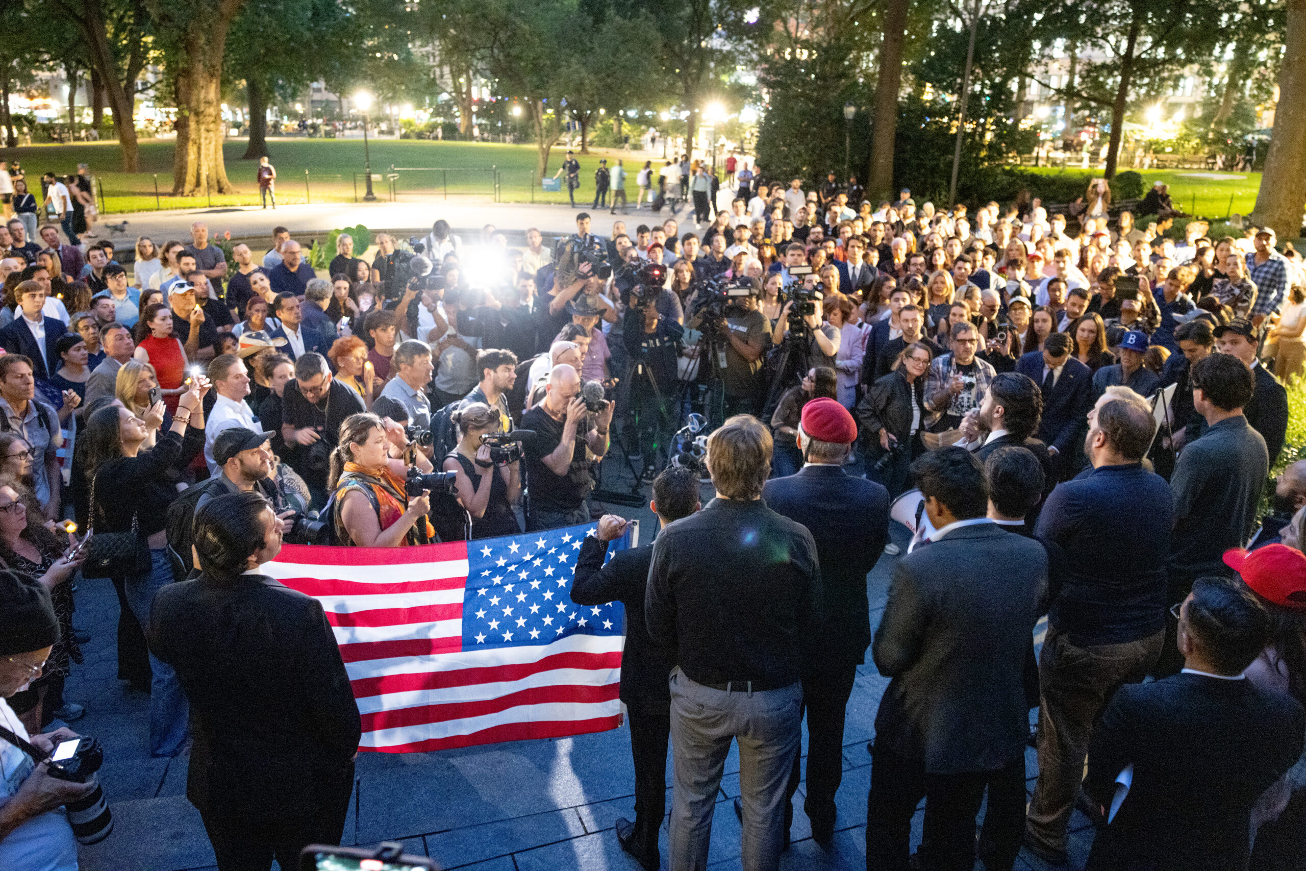 Vigil for Charlie Kirk draws flag-waving crowd in Manhattan as mourners gather for remembrance