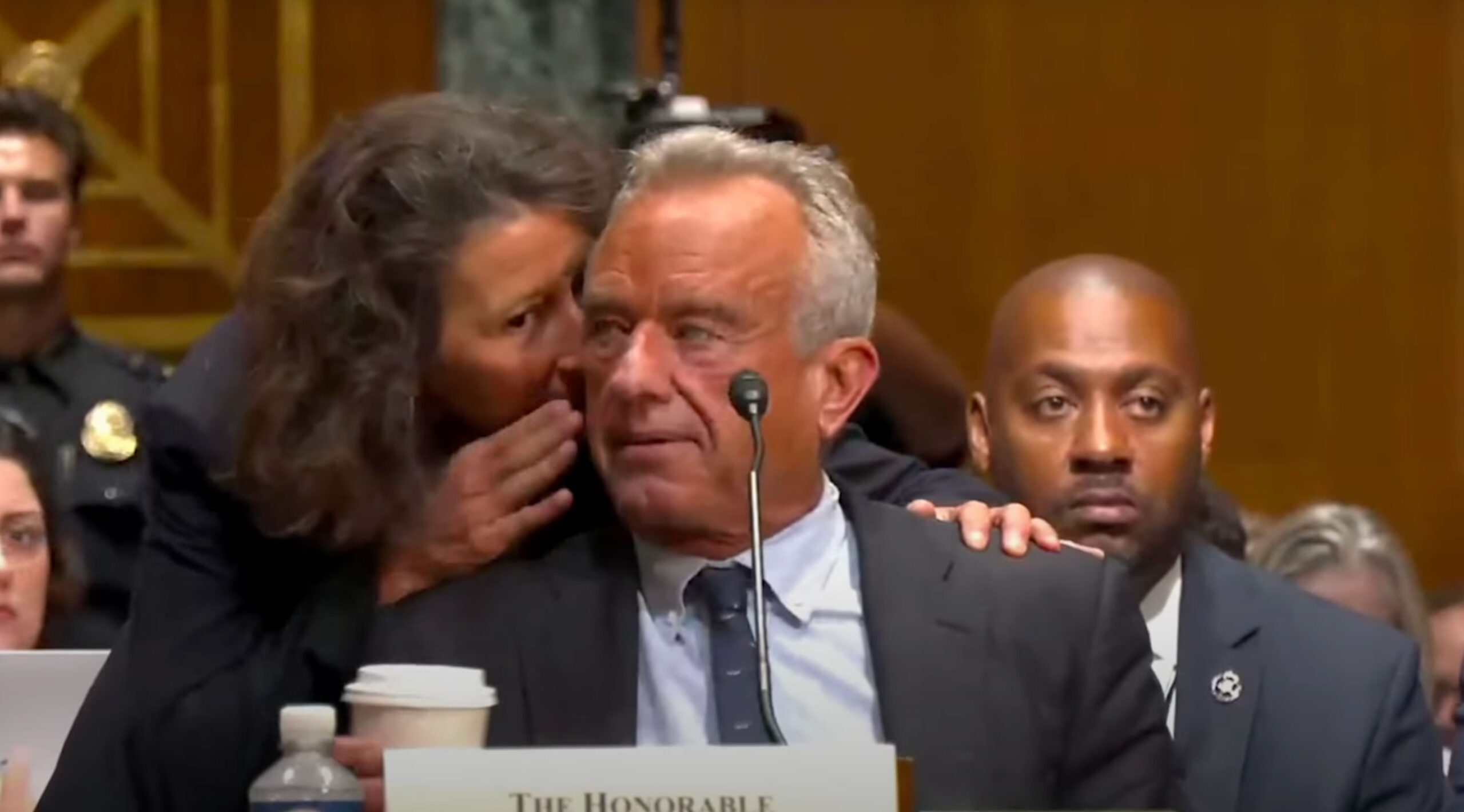RFK Jr. rushes to mute microphone after aide appears to point out his huffing and heaving