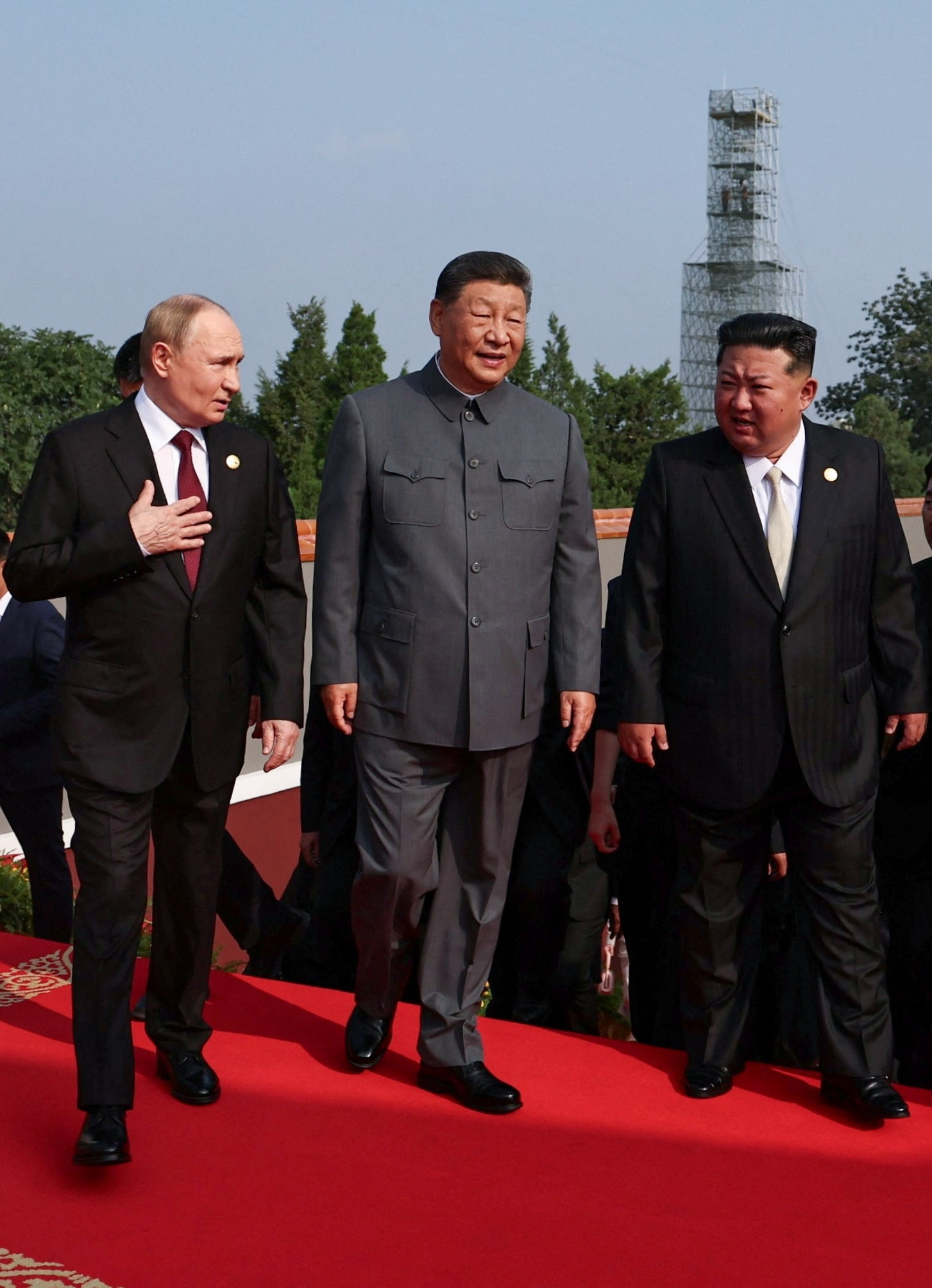 Trump accuses Putin, Kim Jong Un and Xi Jinping of conspiring against the US as they meet at military parade in China 