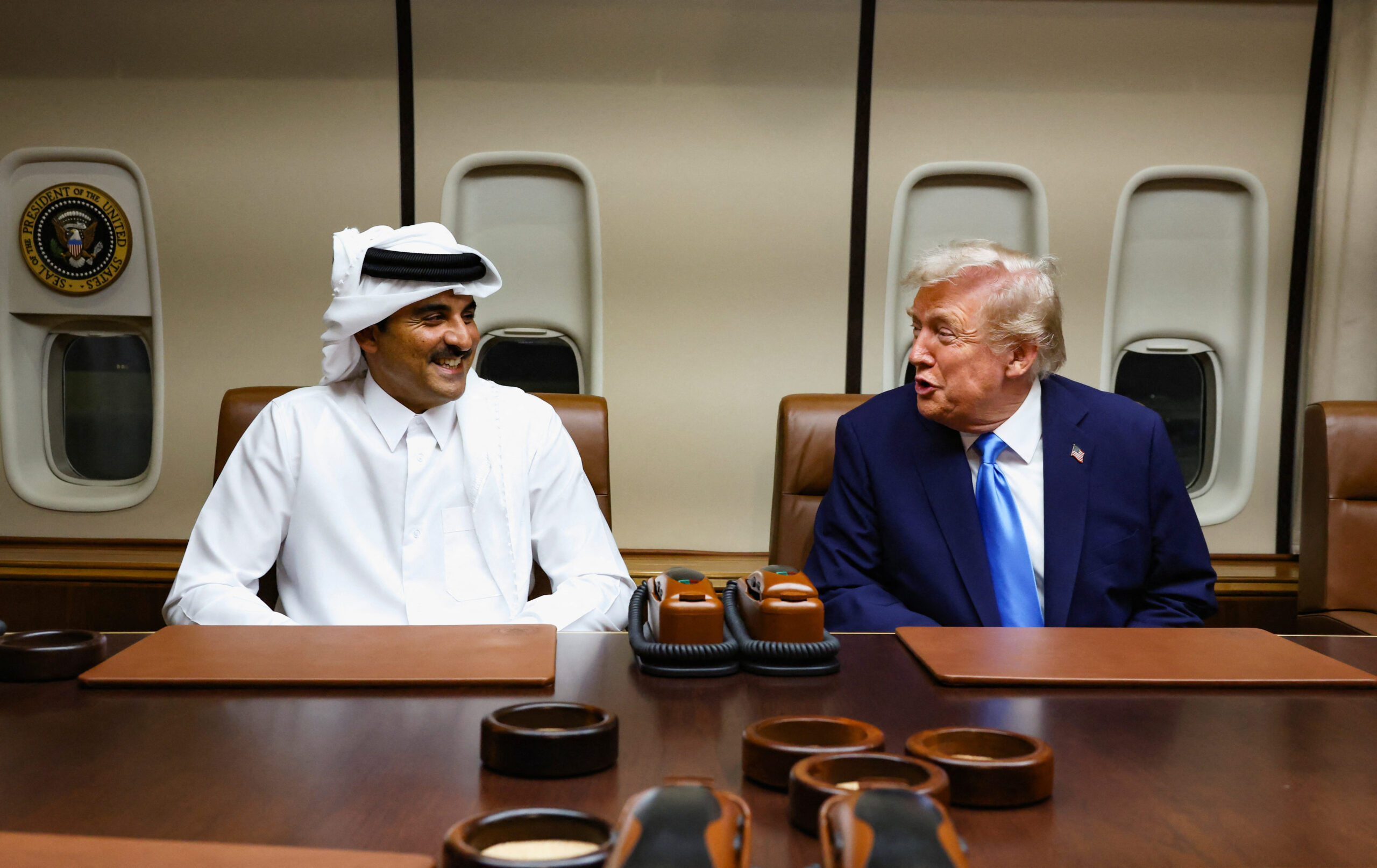 Trump hosts Emir of Qatar on Air Force One as he makes way to Asia