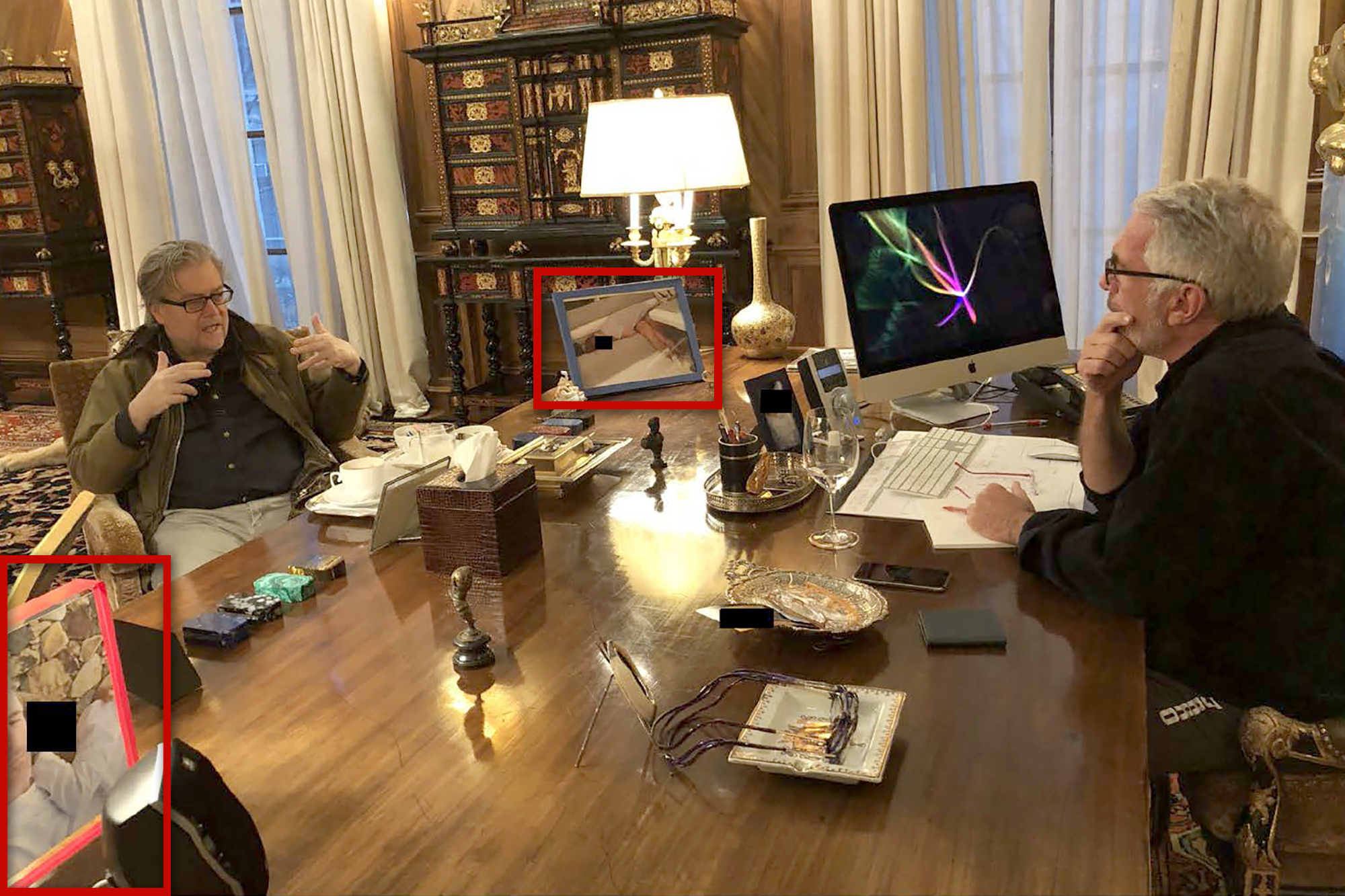 Everything we know about the creepy photo Jeffrey Epstein had of a lounging woman on his desk