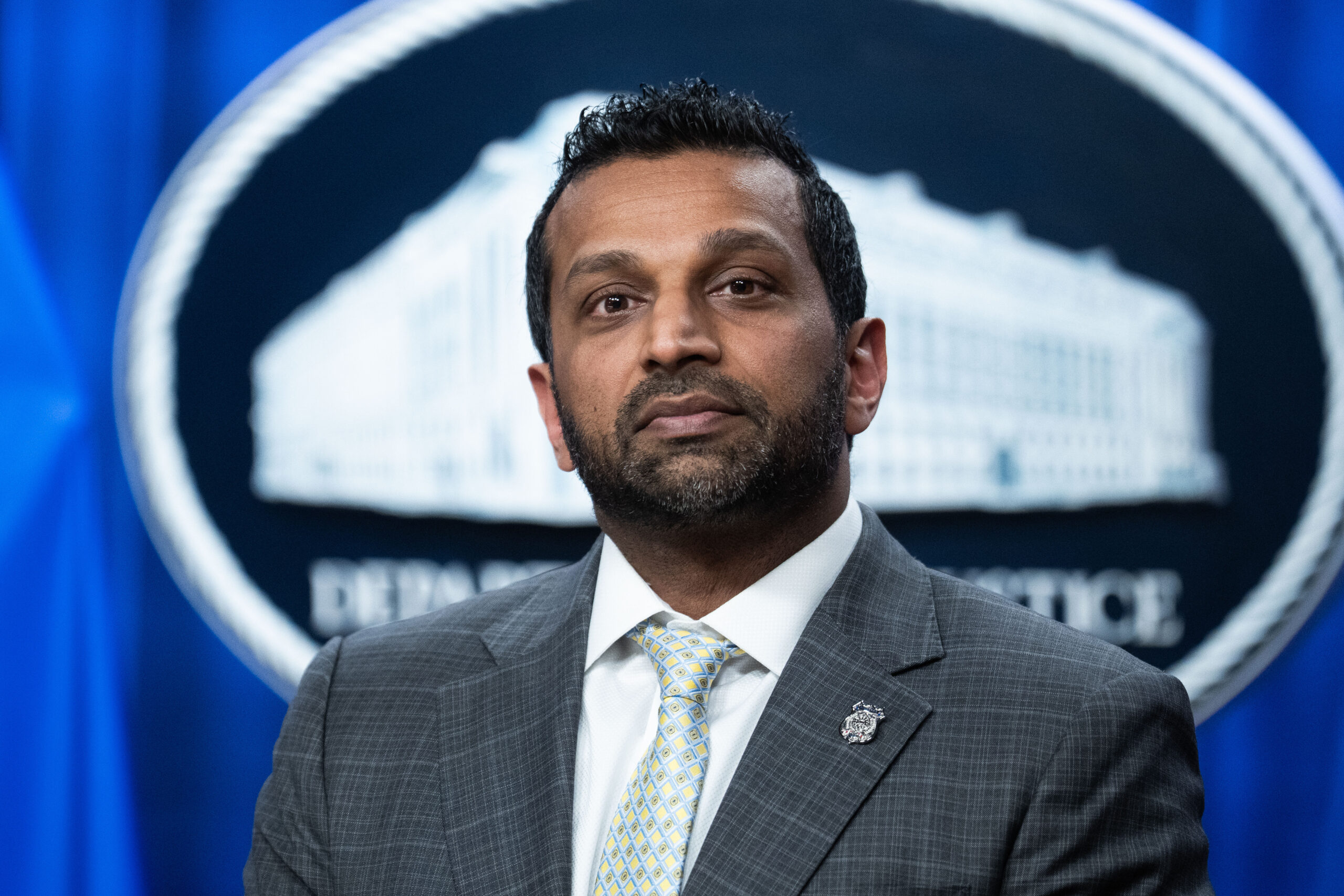 Kash Patel hands out bespoke bourbon bottles while suing Atlantic over reporting on his drinking