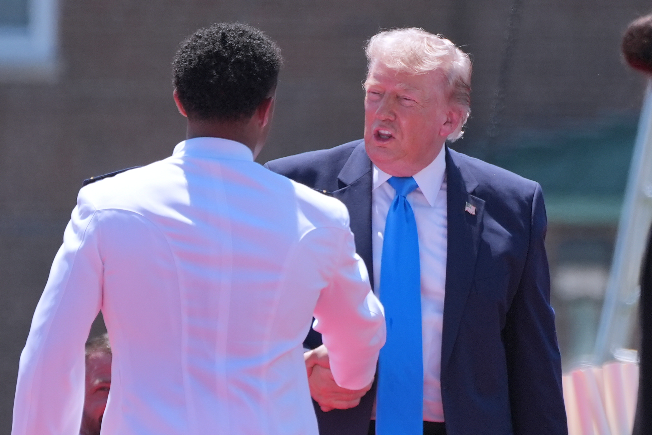 Trump has ‘a little fun’ with Coast Guard grads: ‘Look at the muscles on this guy’