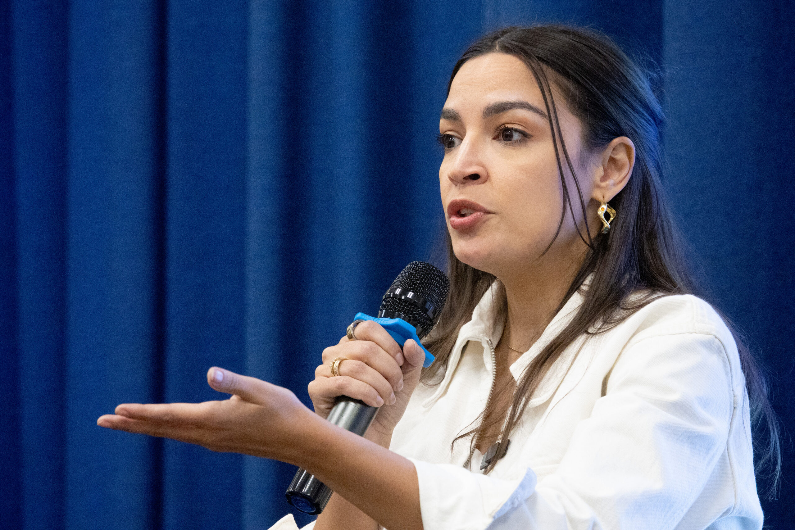 AOC says Congress should break up Apple amid looming price hikes for MacBooks and iPhones