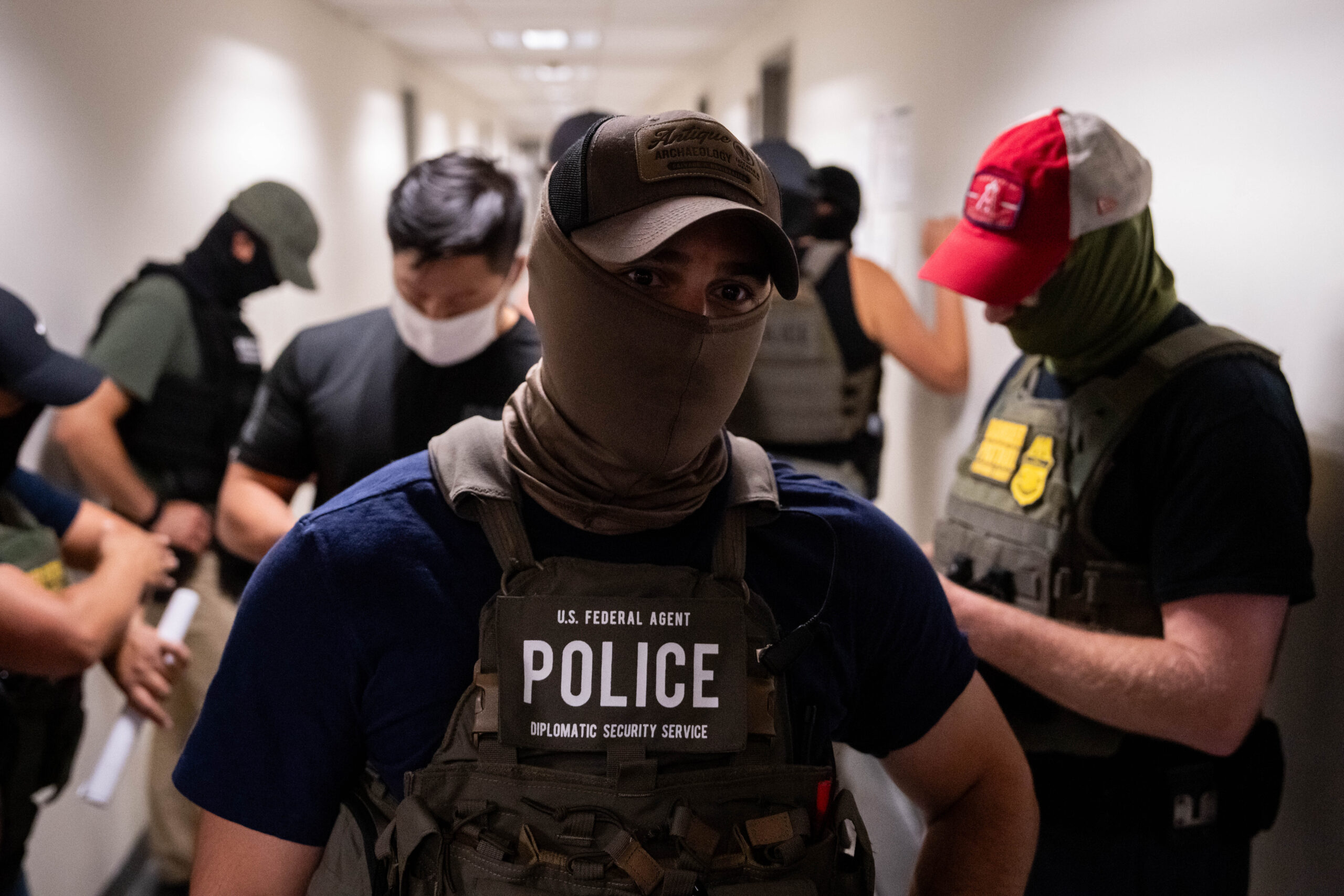 DOJ sues New York over law barring federal agents from wearing masks