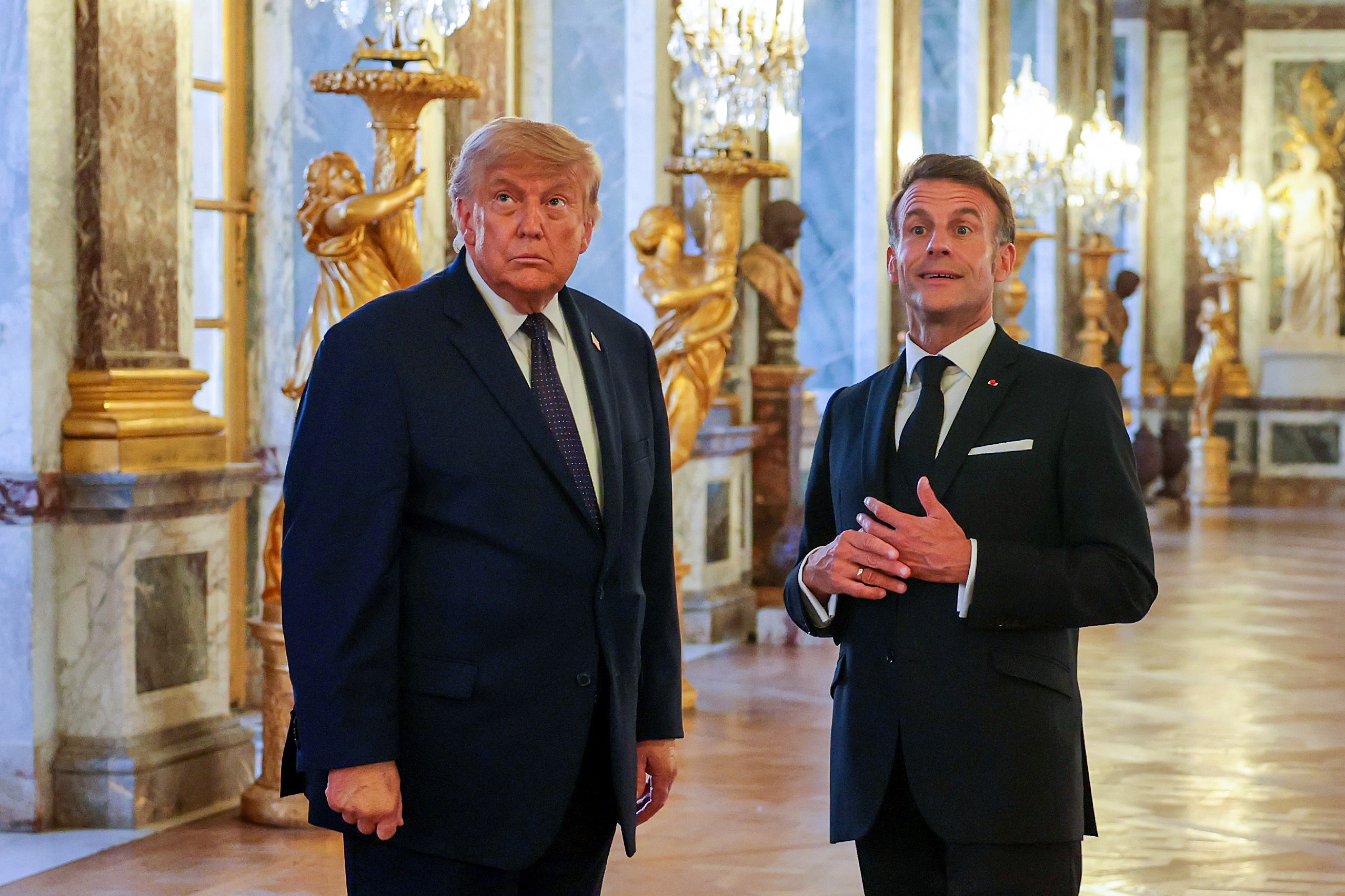 Trump signs Iran deal again — this time by hand over palace dinner with Macron