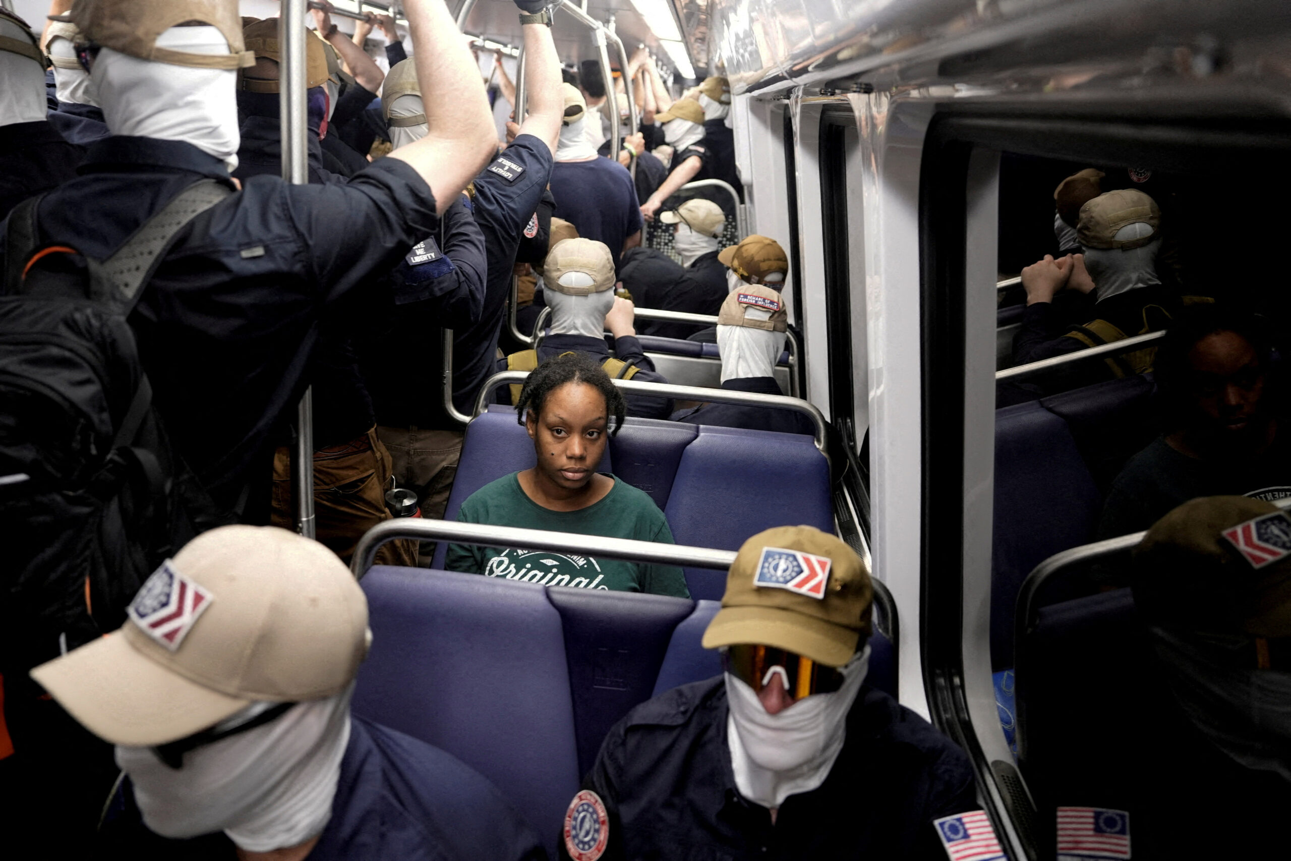 Chilling photo shows black woman on DC train surrounded by white supremacist thugs