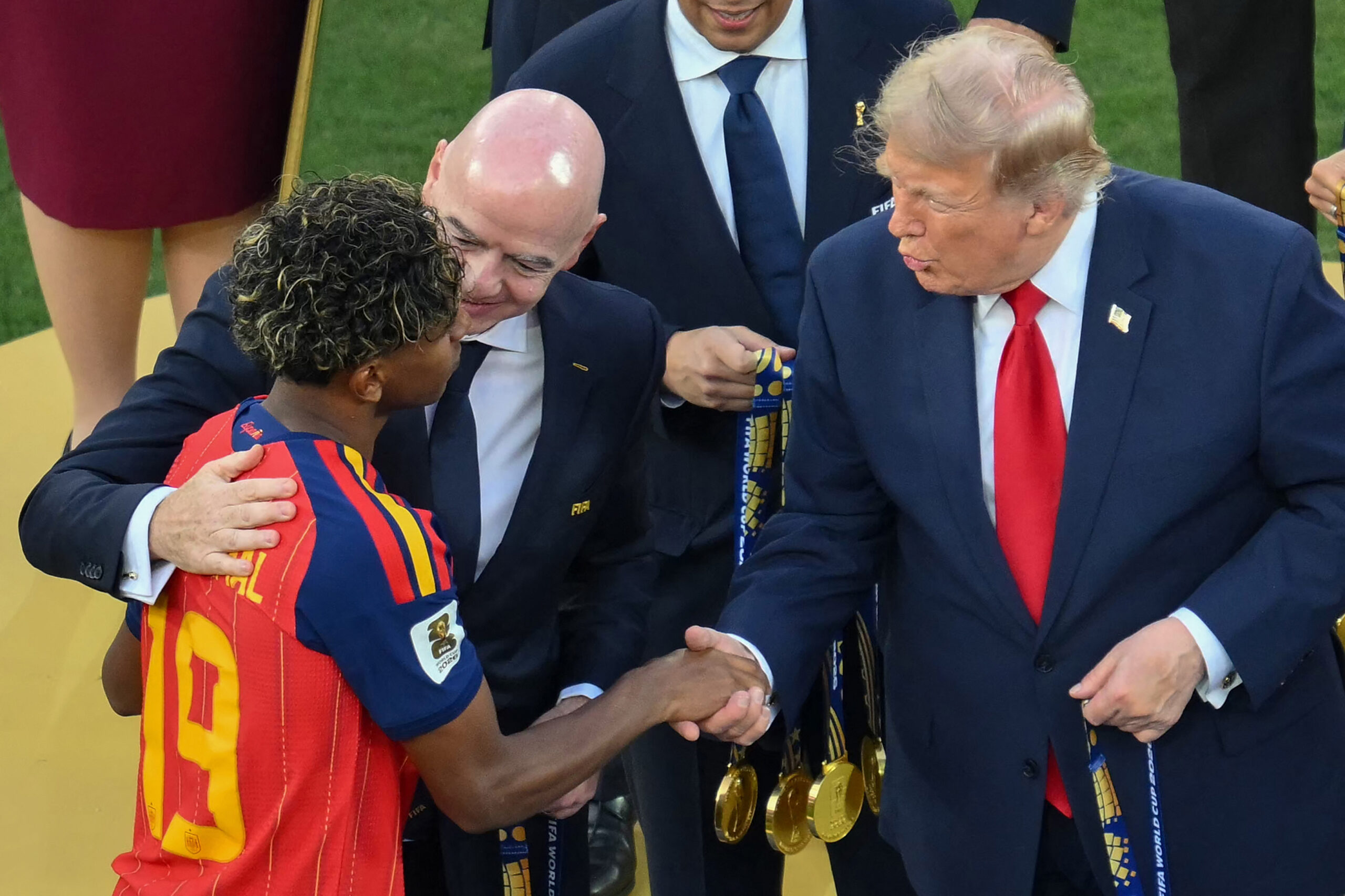 Trump and FIFA prez come on the field to hand off World Cup trophy to Spain