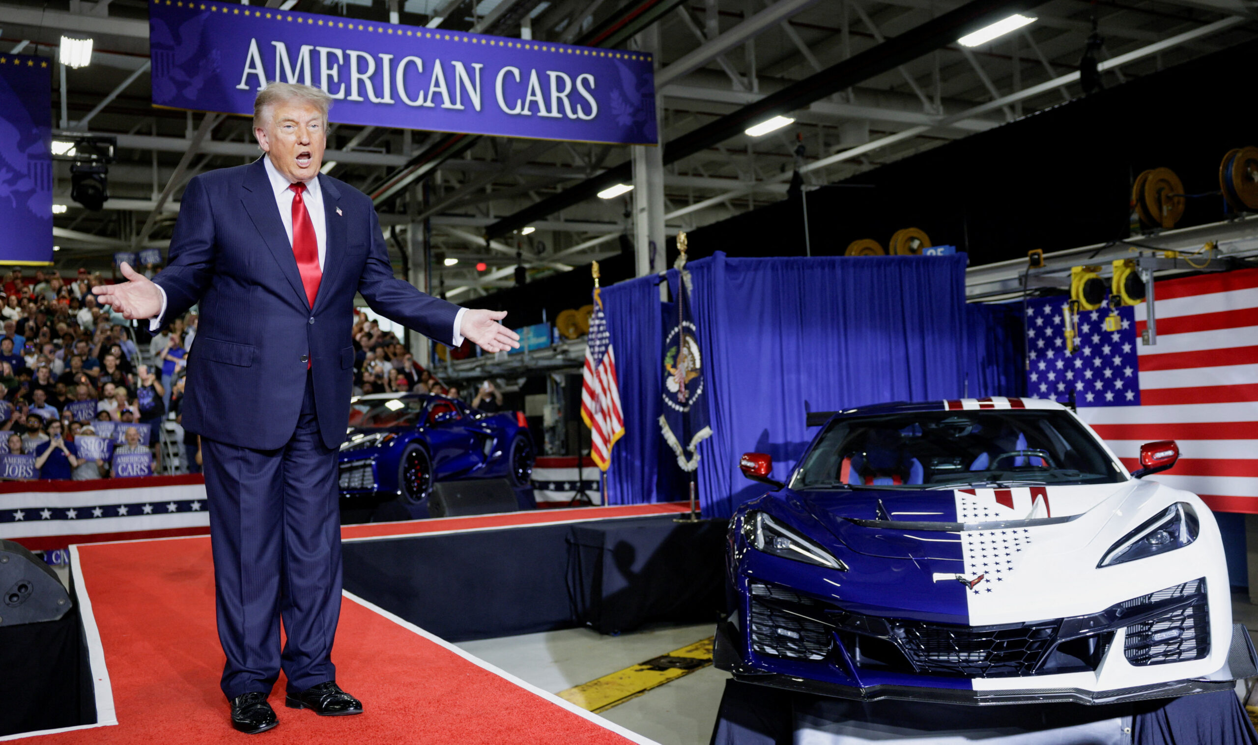 Trump trumpets tariffs, signs a Corvette, and tells Michigan autoworkers: ‘I’ve done more for you than your parents’